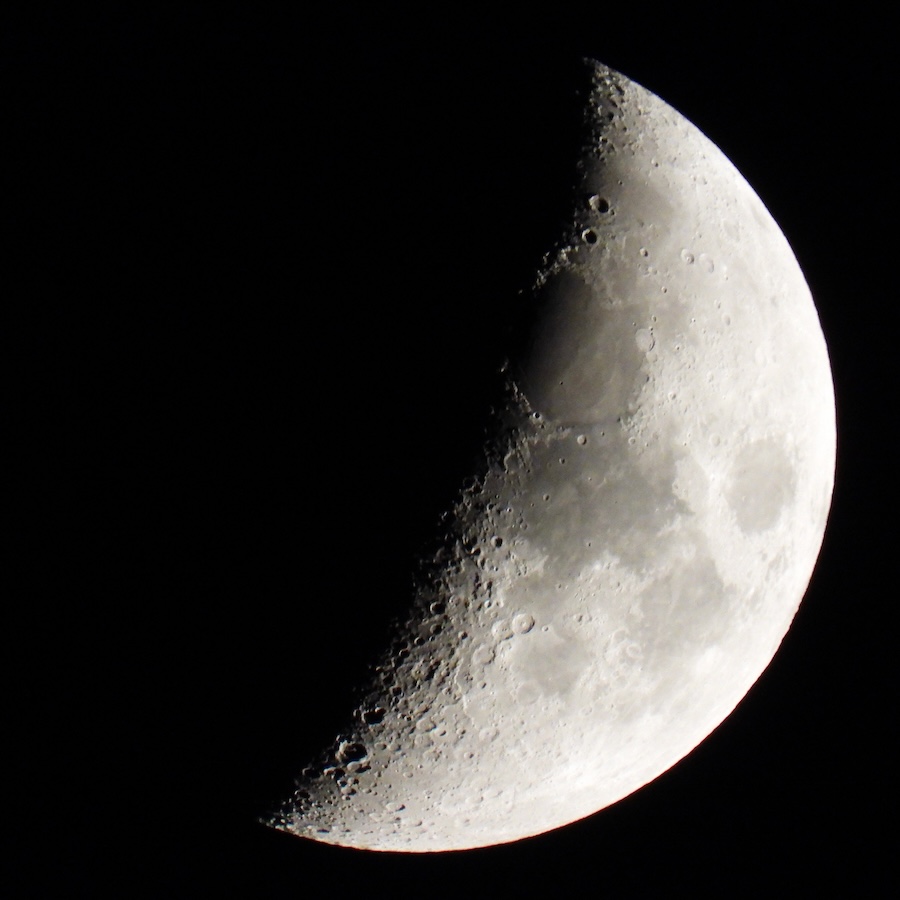 Crescent moon photographed with a Nikon P1100, showing the dark oval of Mare Crisium near the terminator line